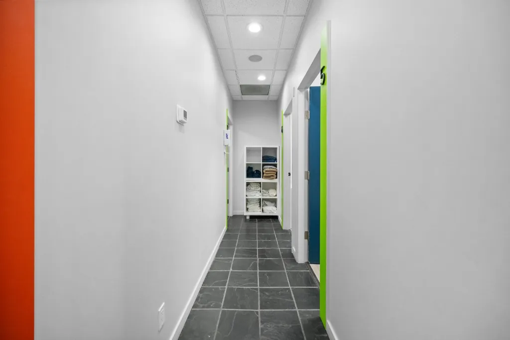 Revive Rehab Surrey Scott Road Treatment Room Hallway with Colored Trim